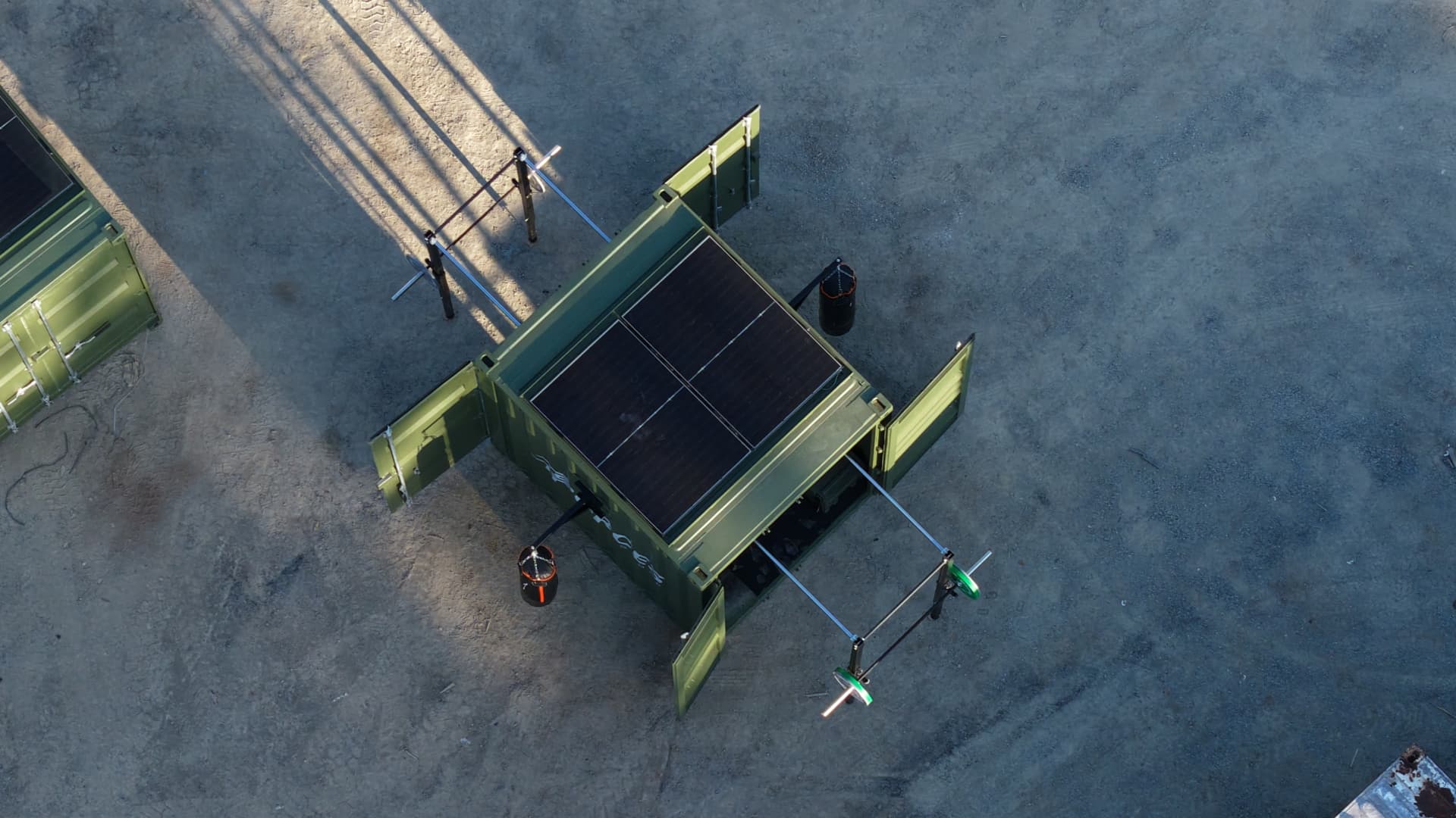Aerial view of a deployed FORCES Rapid system with solar panels and training attachments