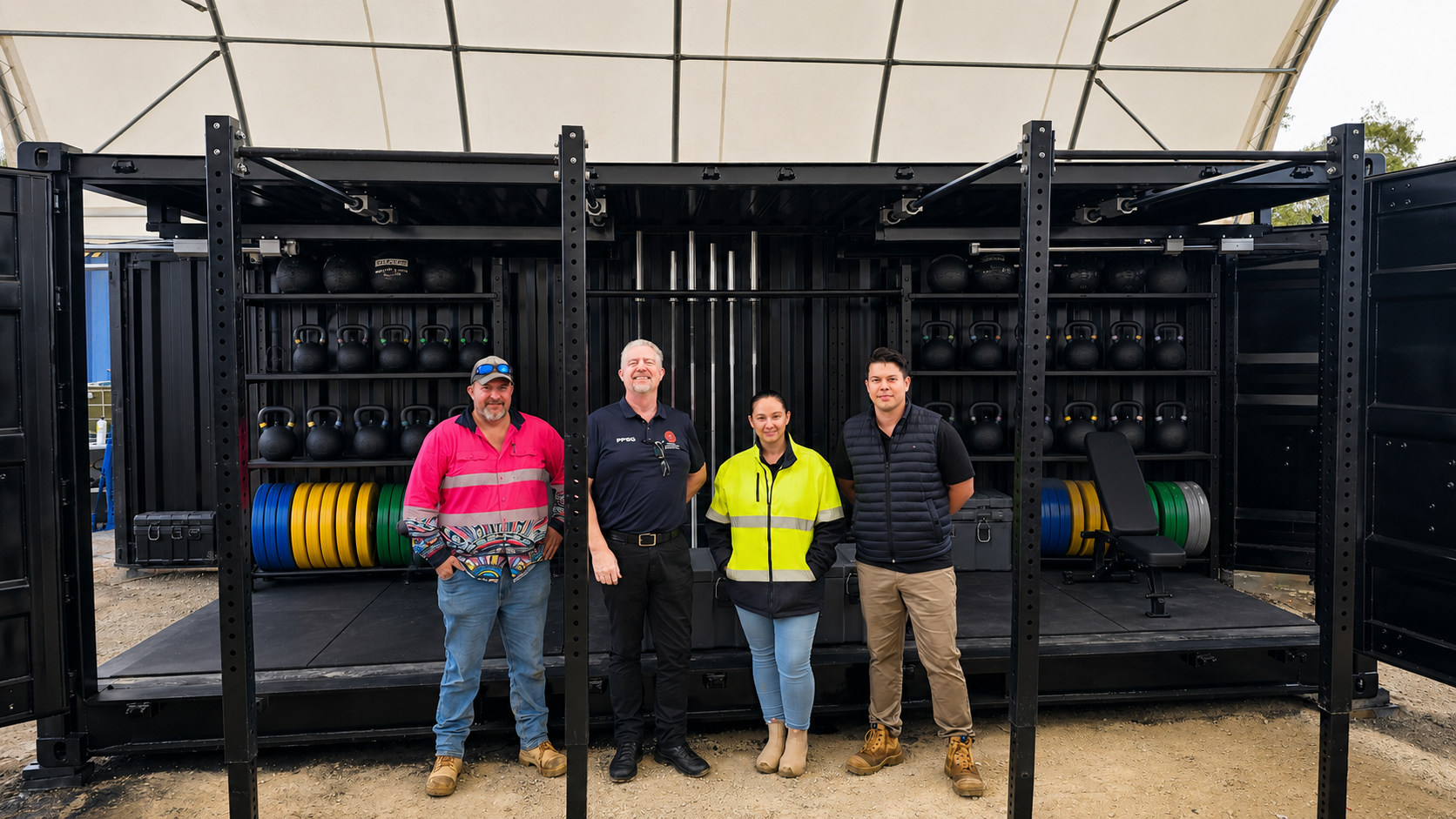 Forces Group and Australian Federal Police personnel with the completed open deployable unit prior to deployment to Papua New Guinea
